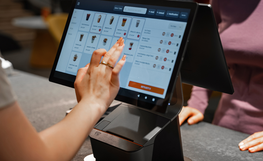 Staff selecting items on SUNMI POS touchscreen