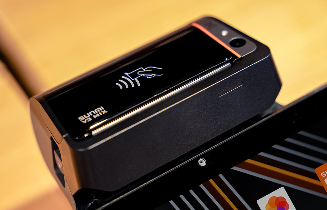 SUNMI V3 MIX terminal processing payment at restaurant counter - Fiserv integration